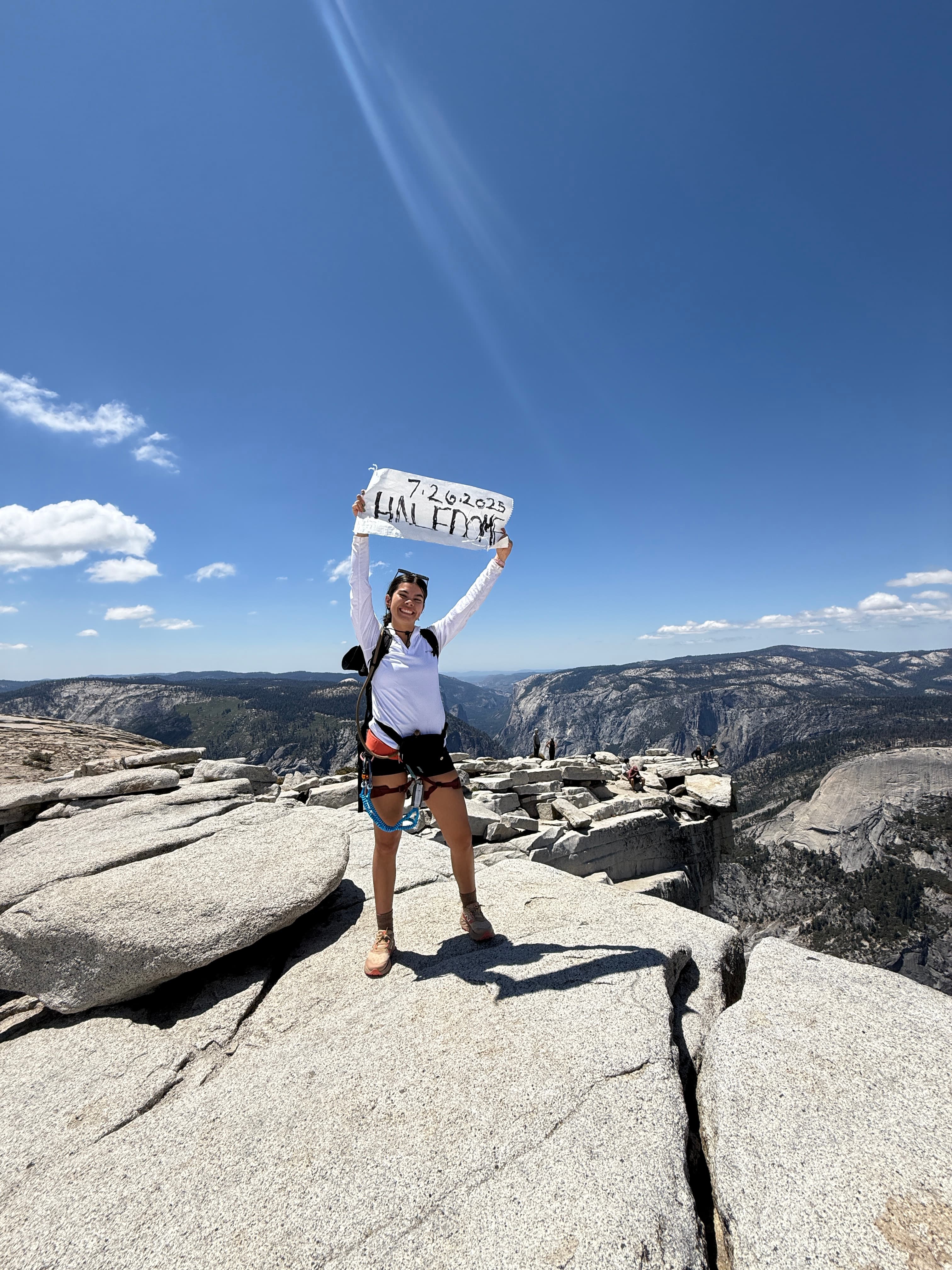 Outdoor athlete standing on a mountain summit
